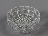 an antique cut glass bowl with a flower design on the rim