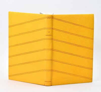 the yellow book is open on a white surface