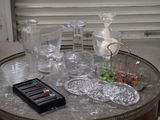 a table that has a lot of glass items on it