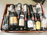 many bottles of wine in a wooden box on the floor