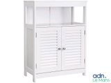 the cabinet is white and has shutters on the doors