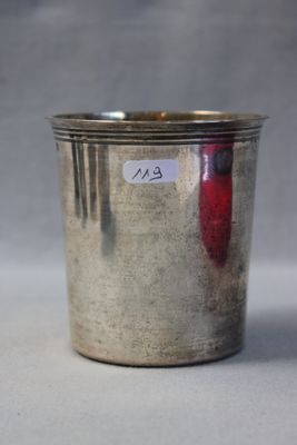 a silver cup with a sticker on it