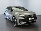 a grey audi qx parked in a showroom