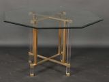 an image of a table with a glass top and gold metal legs