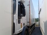 a truck that is parked next to a building