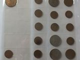 a lot of coins that are in a plastic container