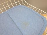 a chair with a blue seat pad on it