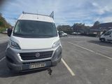 a white van that is parked in a parking lot