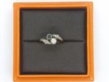 an image of a diamond ring in a box on a white background