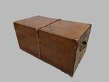 an old wooden trunk with a metal latch on it