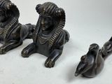 three figurines that are sitting next to each other