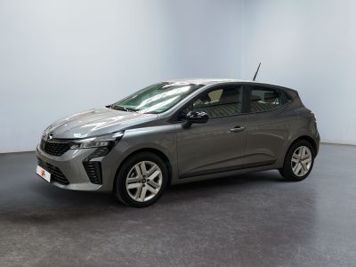 a grey car is parked in a room with a black floor