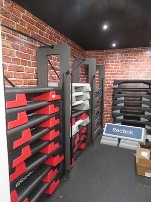 a room that has a bunch of shelves and boxes on it