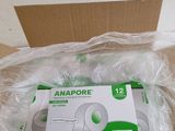 une photo d'une boîte de comprimés Anapore posée sur une boîte en carton