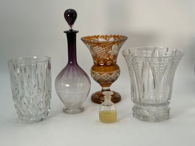 a lot of glass vases sitting on a table