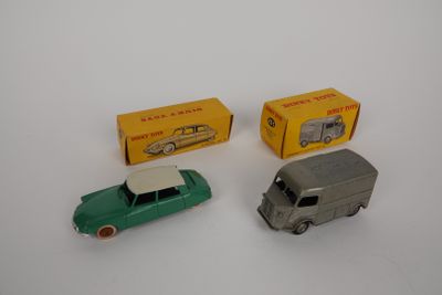 three toy cars are sitting next to each other on a white surface