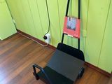 a black cart with a book on it in a room