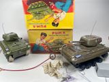 a small toy tank and a small toy tank on a table