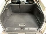 a trunk of a car with the back seats folded down