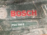 a close up of a piece of wood that has a bosch logo on it