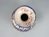 a blue and white vase with writing on it