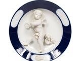 a plate with a picture of a child on it