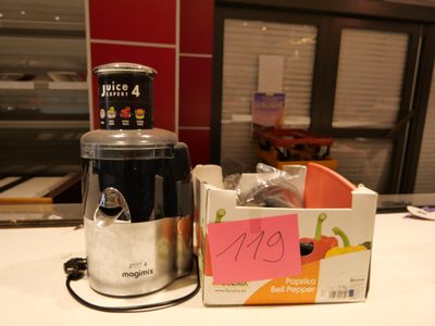 a blender sitting on a counter next to a box of food
