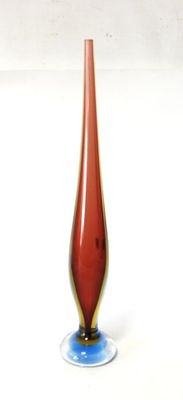 a red glass vase with a blue base on a white surface
