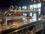 a bar with a bunch of beer taps on it