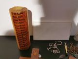 a cross, rosary, and other religious items on a table