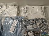 many items that are wrapped in plastic bags on the shelf