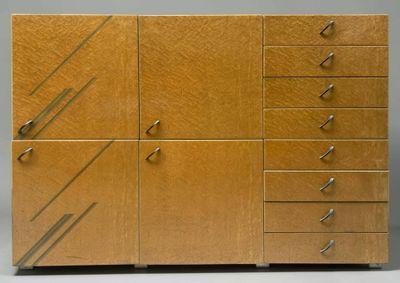 an image of a wooden cabinet with drawers and drawers