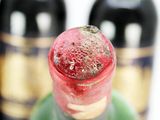 a close up of a bottle of wine with a cork stopper