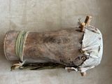 a wooden object with a cloth wrapped around it on a table