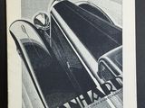 une vieille photo en noir et blanc d'une voiture sur laquelle on peut lire « Dan Harbas »