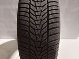 a close up of a tire on a white surface