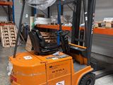 a forklift truck that is parked in a warehouse