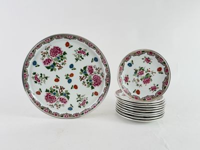 four plates with floral designs are stacked on top of each other