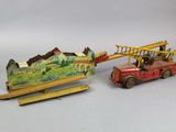 two toy vehicles that are sitting next to each other