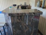 a marble counter top in the middle of a room