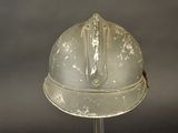 a white helmet on a stand with a black background
