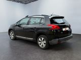 the back end of a black car in a white room