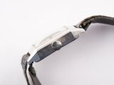 a close up of a watch on a white surface
