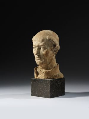 a roman marble bust of a man on a marble base