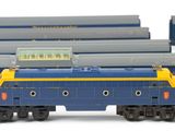 three blue and yellow trains sitting next to each other