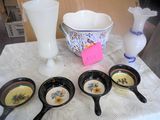 a lot of bowls and spoons sitting on a table