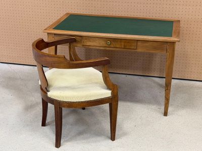 a small desk with a chair next to it