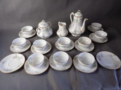 a lot of tea cups and saucers on the table