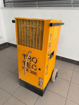 a yellow machine that is sitting on the floor