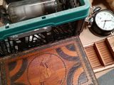 a crate with a clock and other items sitting on the floor